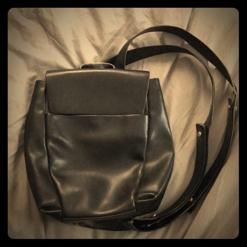 Well worn Mandarina Duck leather mini backpack